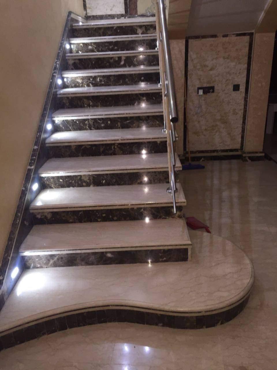 Marble staircase with step lighting